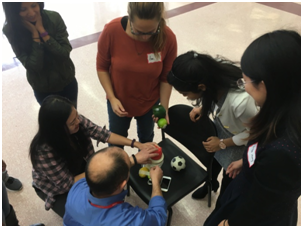 Students work together during the physical team activity
